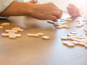 two people playing scrabble
